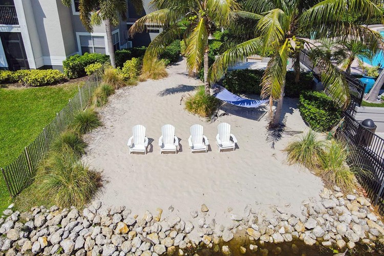 Relax in the sand at our tranquil beach area.
