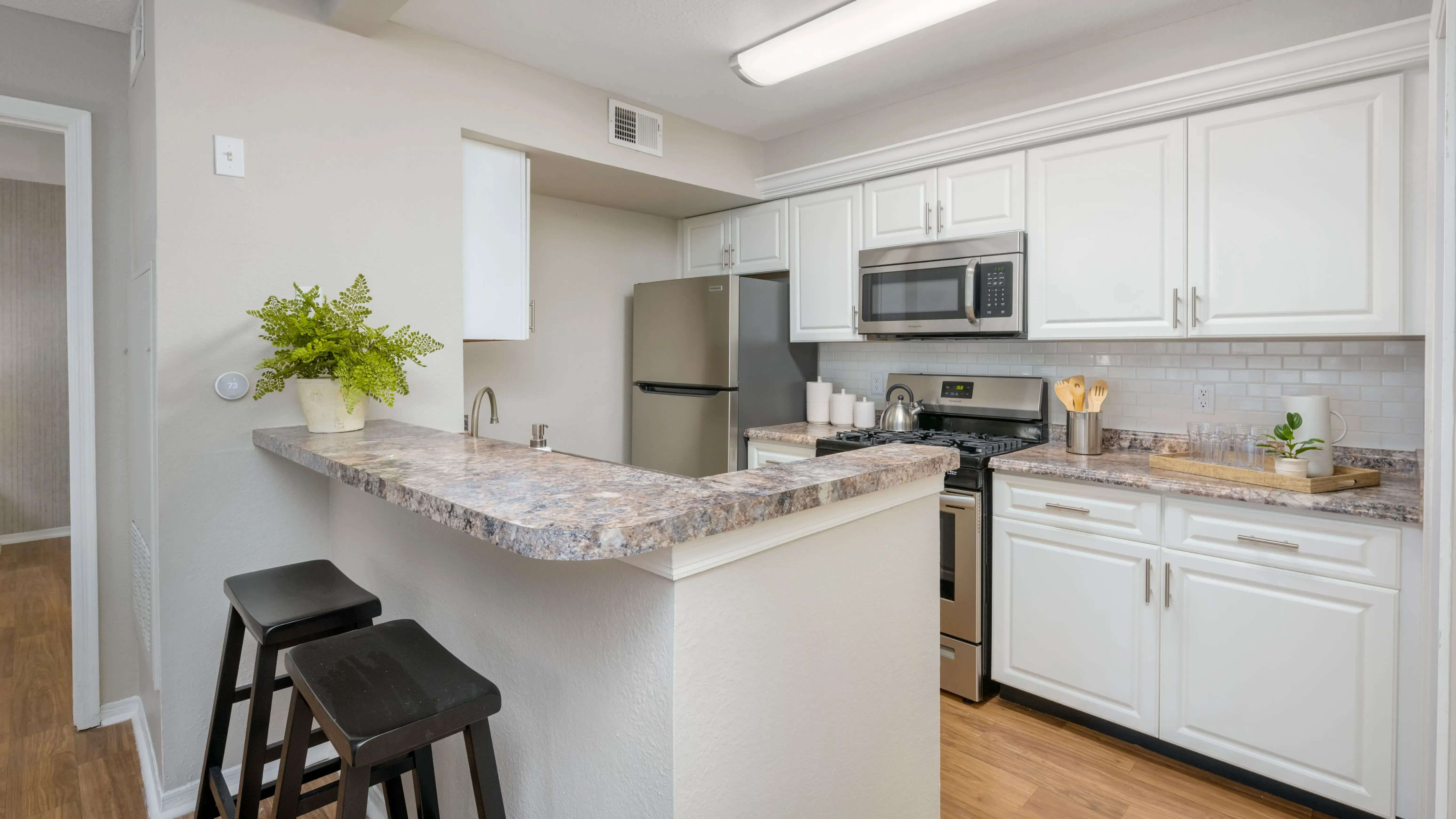 Whip up culinary masterpieces in our spacious kitchen, thoughtfully designed with a breakfast bar for cozy meals and plenty of storage for all your culinary needs.