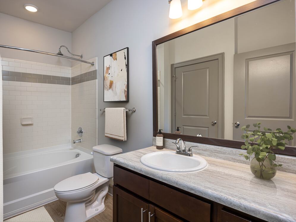 Bath with hard-surface vinyl plank flooring