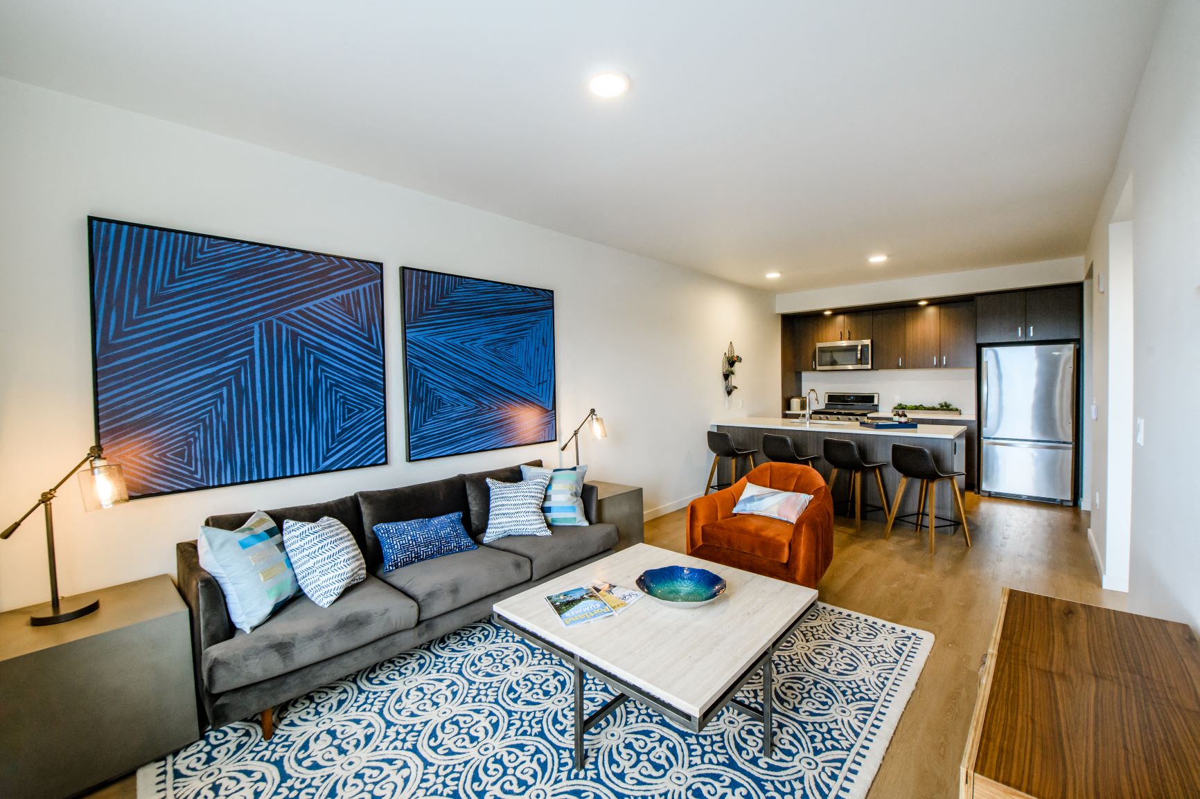 Wood style plank flooring, stainless steel appliances, and gas cooktops, oh my!