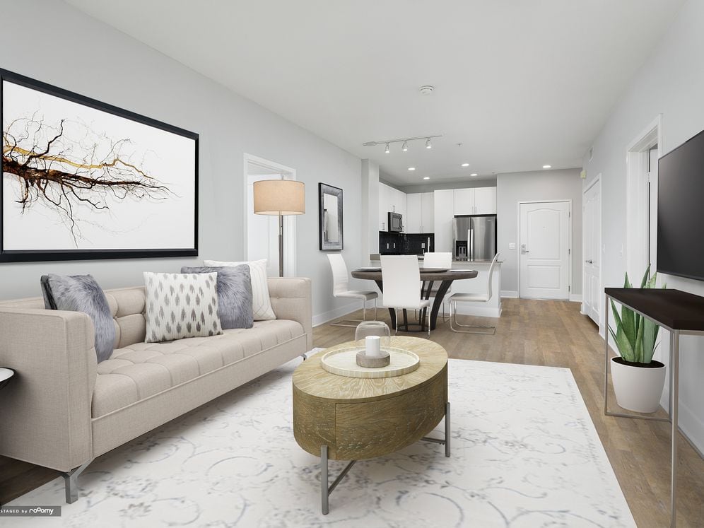 Renovated Package I kitchen, living, and dining areas with hard surface flooring