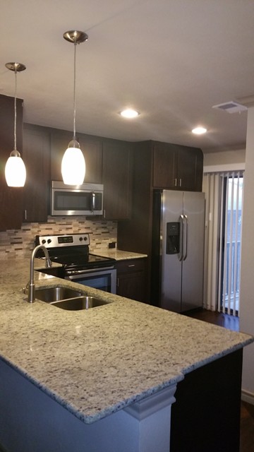 Open gourmet kitchen with washer/dryer connections at your fingertips.. 