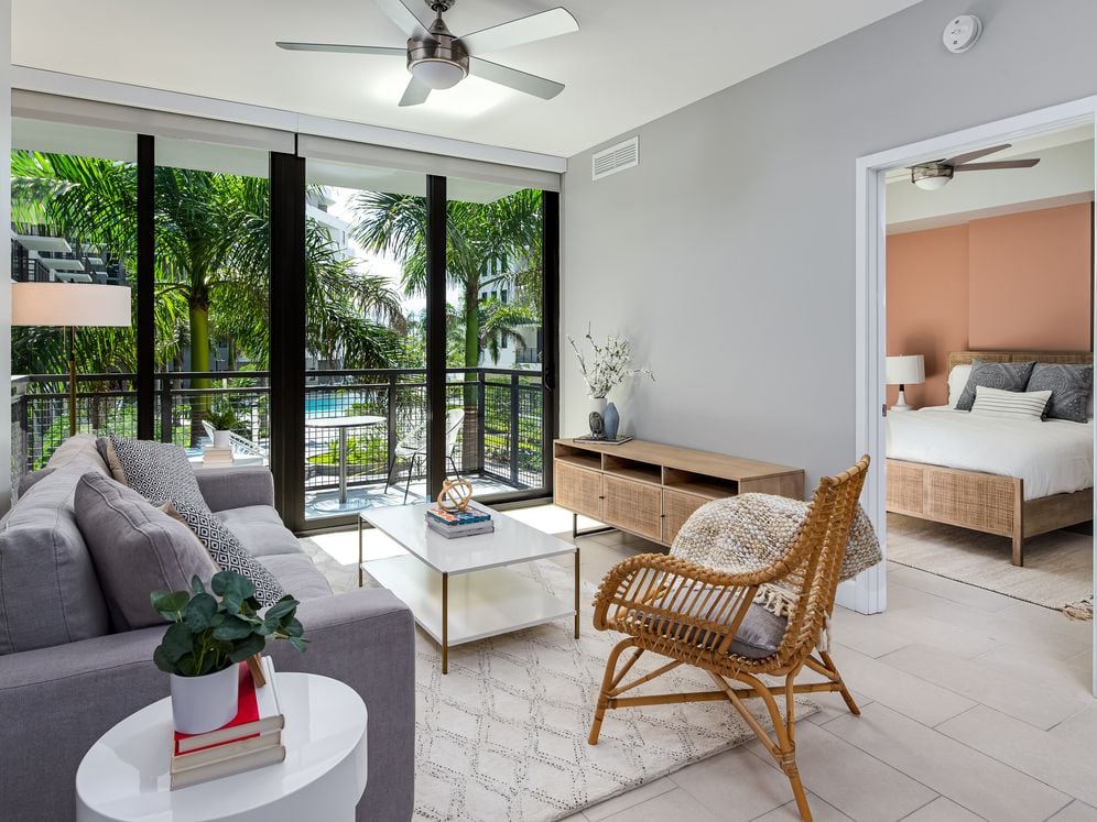 Living area and balcony overlooking pool