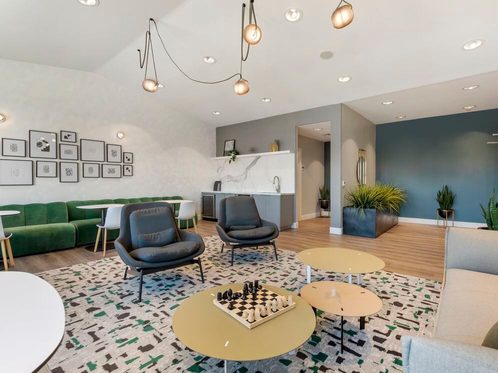 Resident lounge with kitchenette coworking spaces