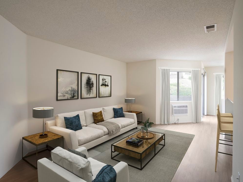 Renovated Package I living room with hard surface flooring