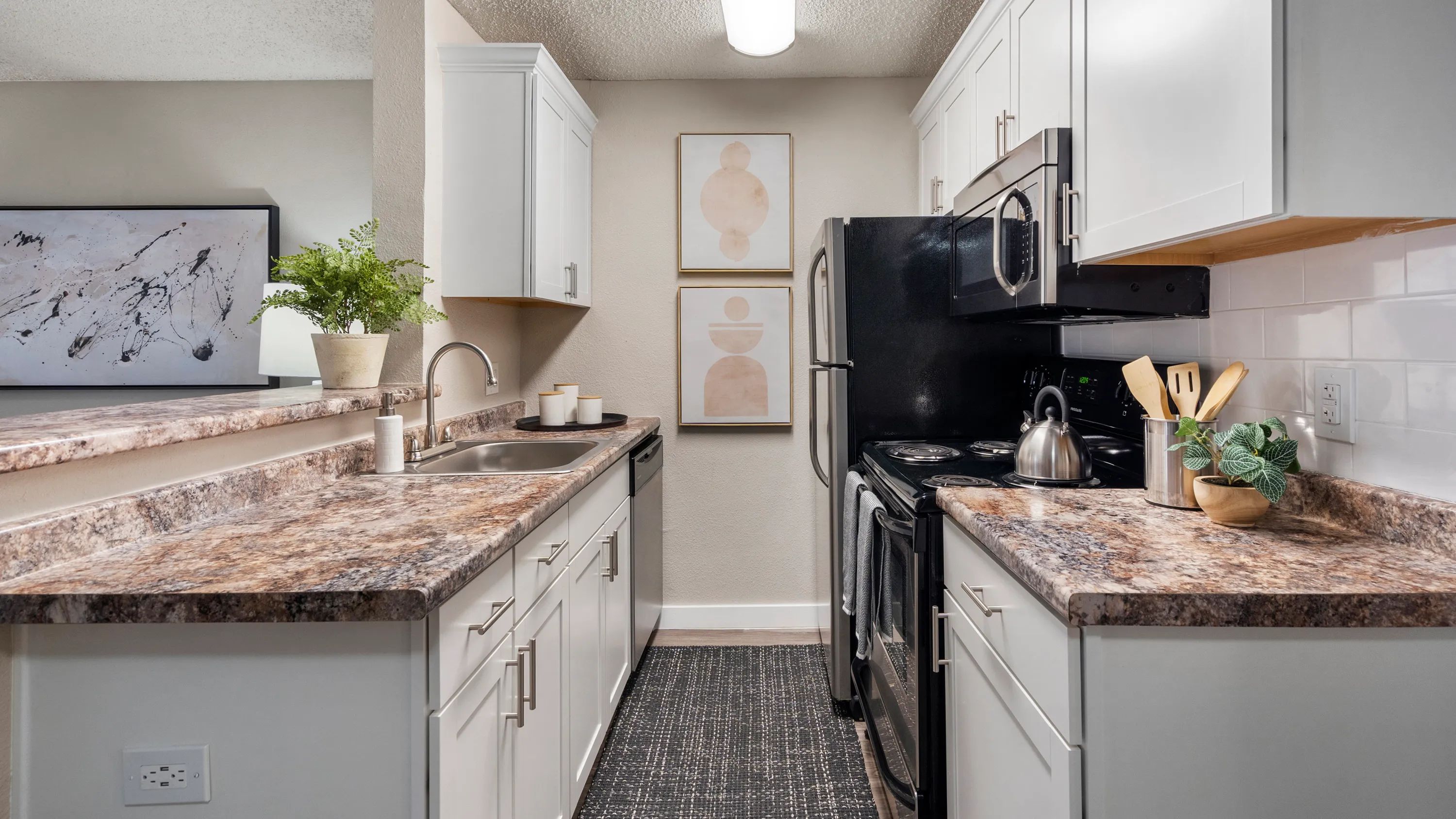 Our galley-style kitchens are designed for efficiency and convenience, with modern upgrades and stainless steel appliances. Cook up your favorite meals with ease in your new kitchen!