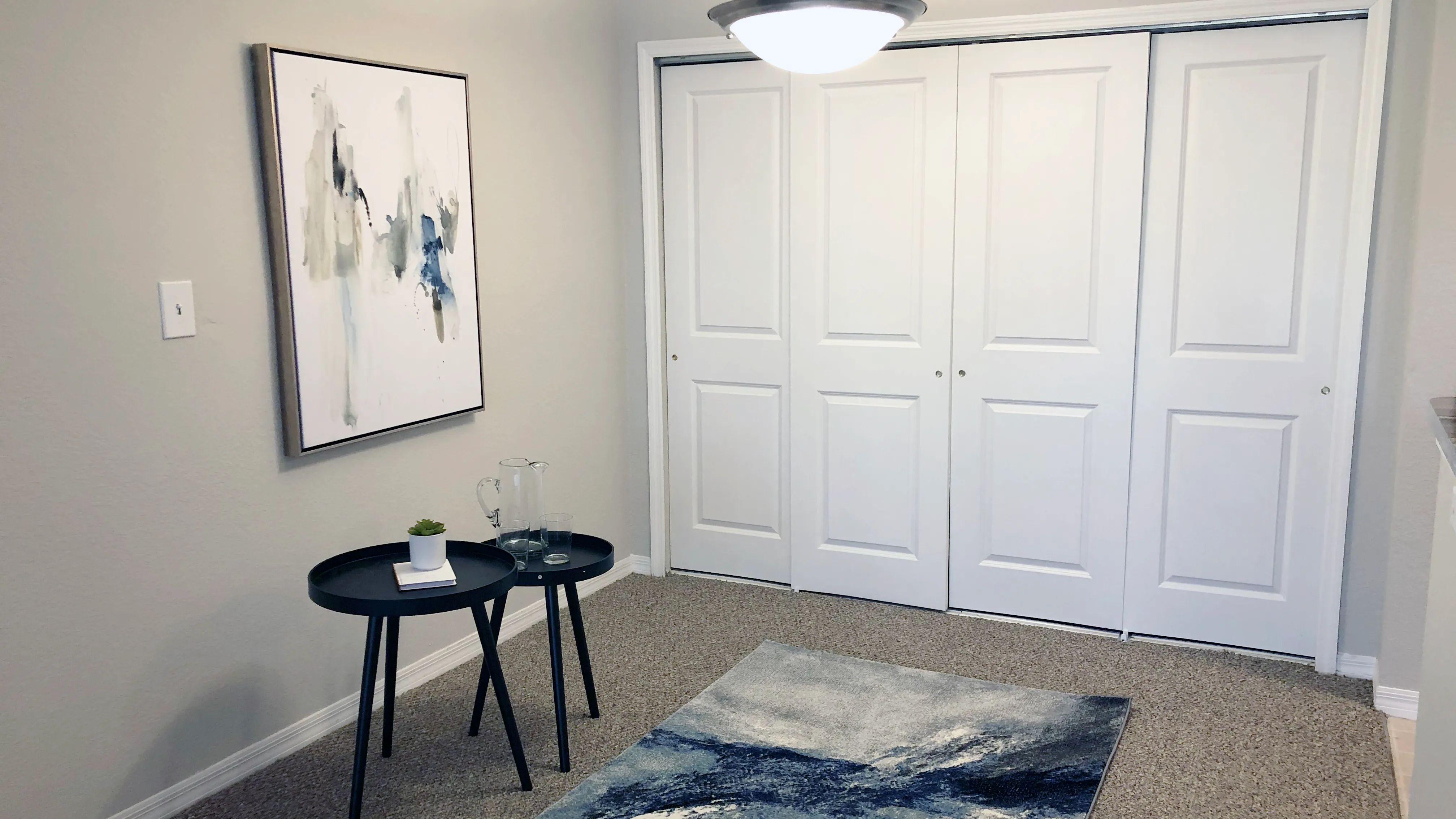 Feast and revel in your cozy, separated dining space. Delight in the warm ambiance with overhead lighting and plush carpeting underfoot.