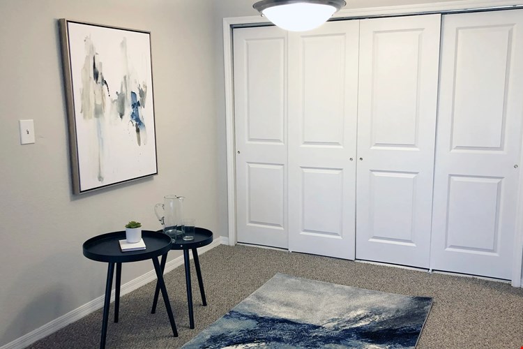 Feast and revel in your cozy, separated dining space. Delight in the warm ambiance with overhead lighting and plush carpeting underfoot.