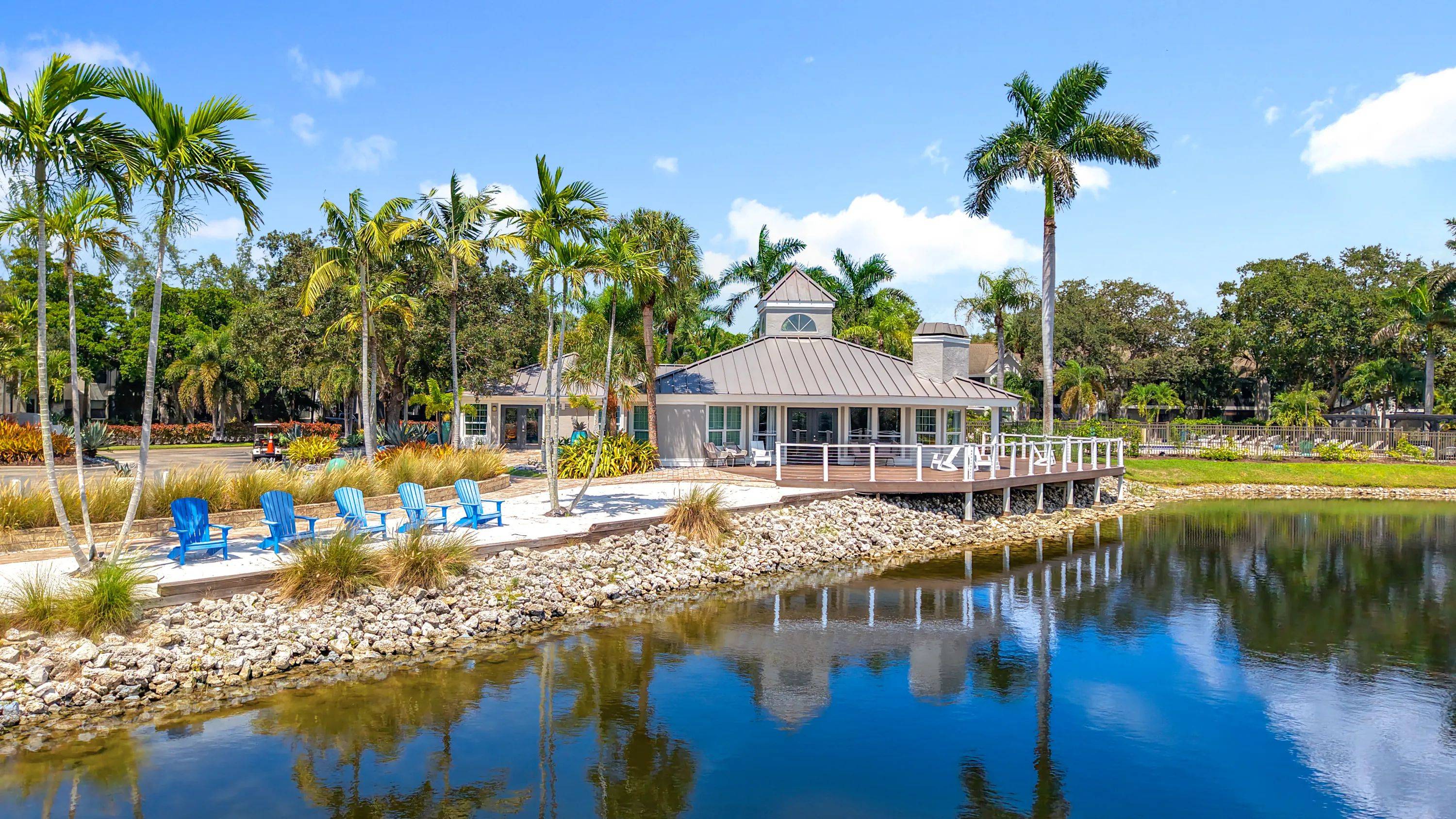 Relax lakeside with unbeatable views of our waterfront clubhouse at River Reach Apartments. From the wraparound deck to the beach-style seating, this serene space offers the perfect escape just steps from home.