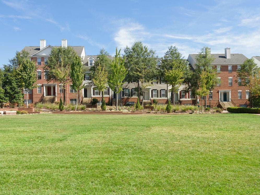 Building exterior with landscaped grass space