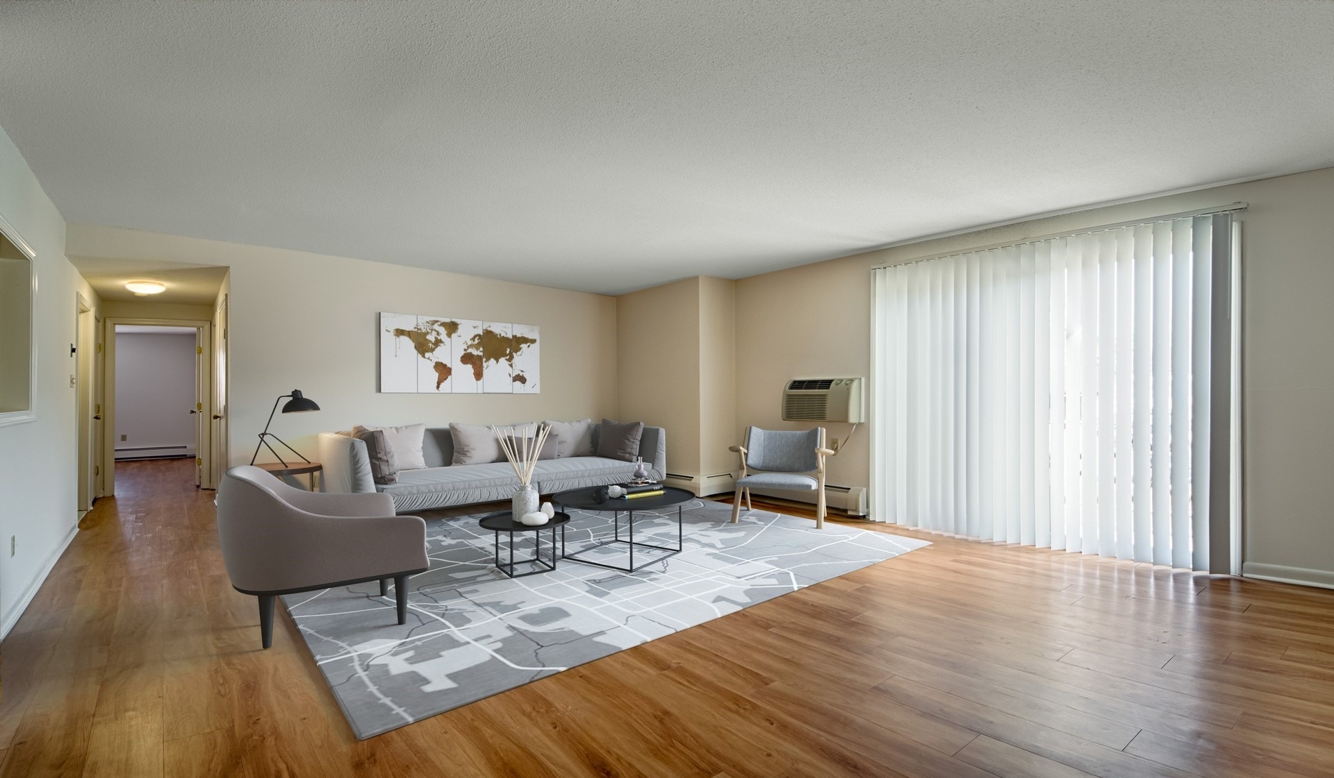 Spacious Windsor living room with wood flooring throughout