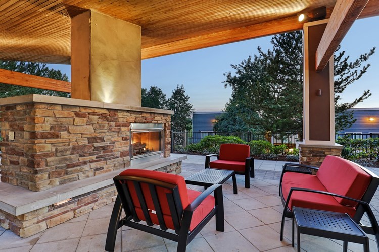 Cozy outdoor fireplace and lounge area