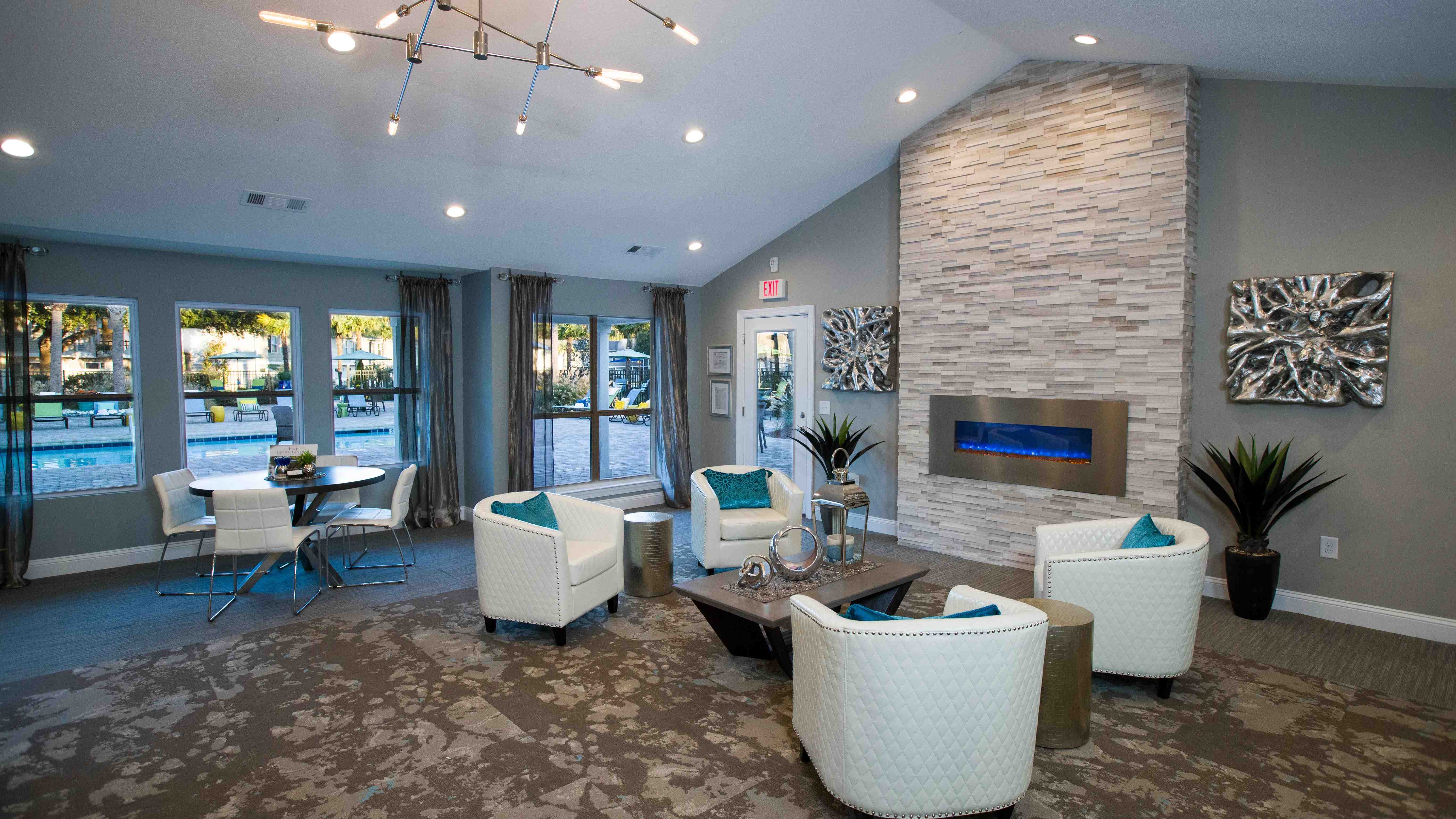 Cozy up by the fireplace in our clubhouse seating area—an invitation to blissful relaxation. 