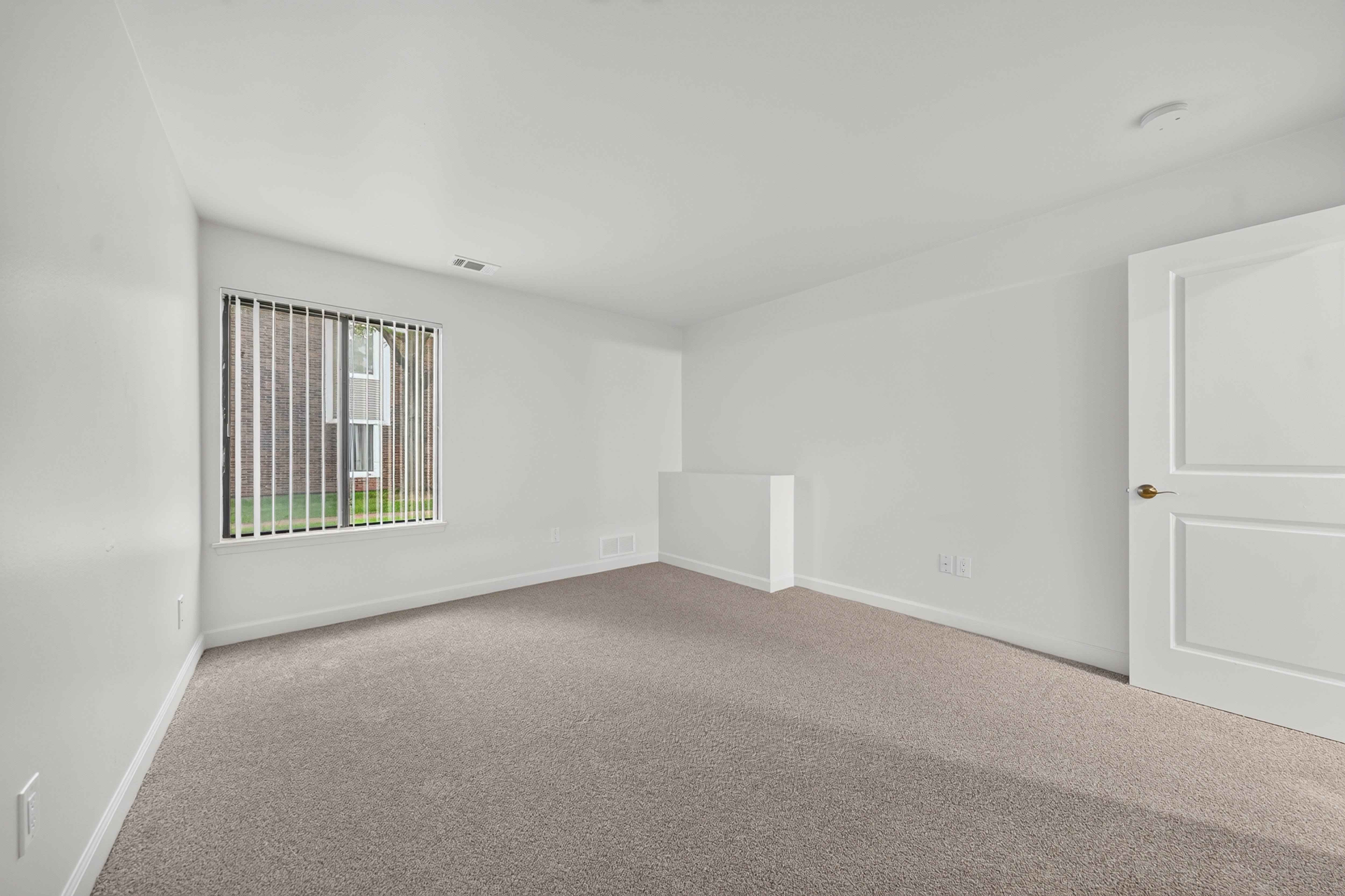 Spacious bedroom with ample storage at Park Lane Apartments in Southfield, MI.