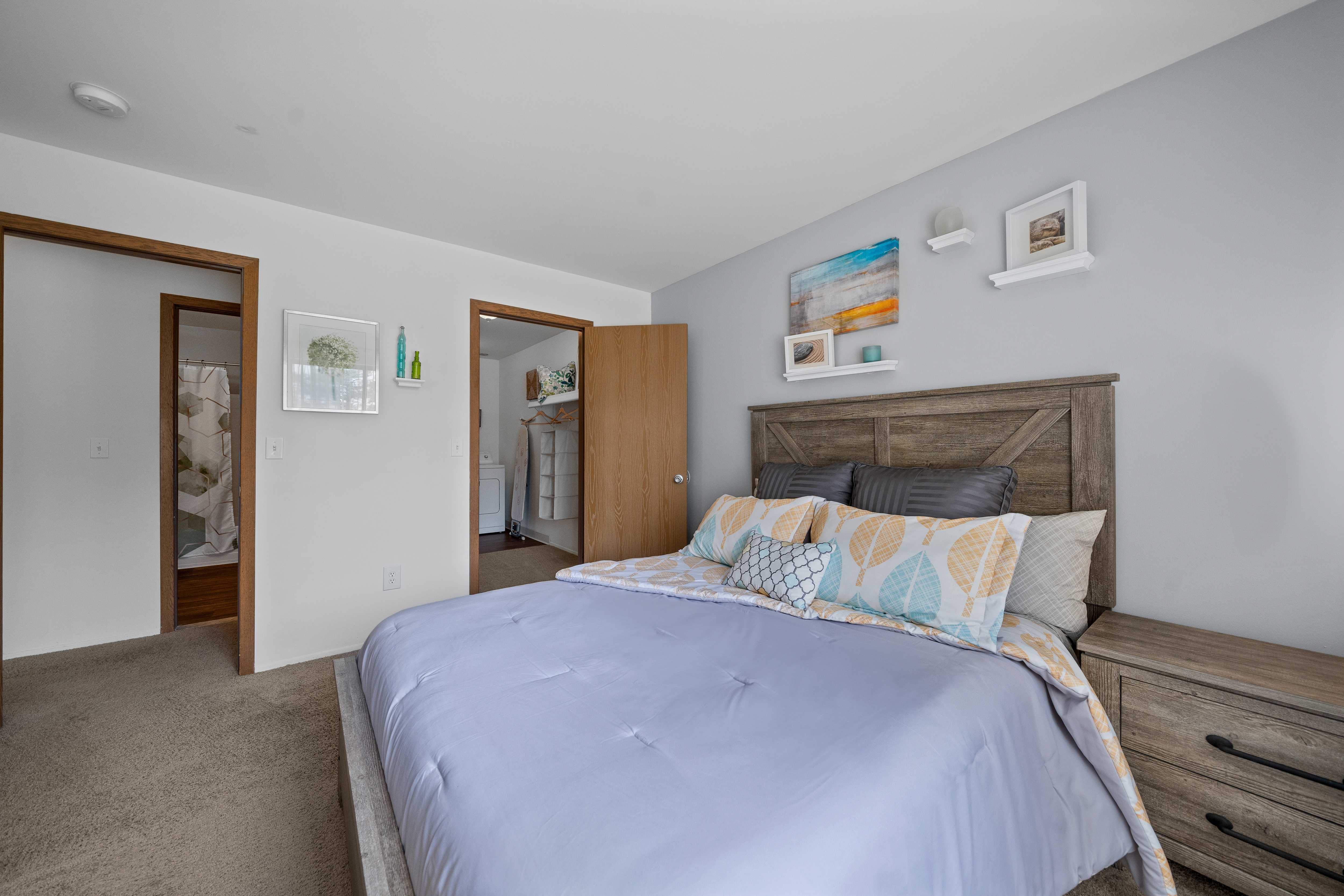 Spacious bedroom with ample storage space at Woodland Villa Apartments in Westland, MI.