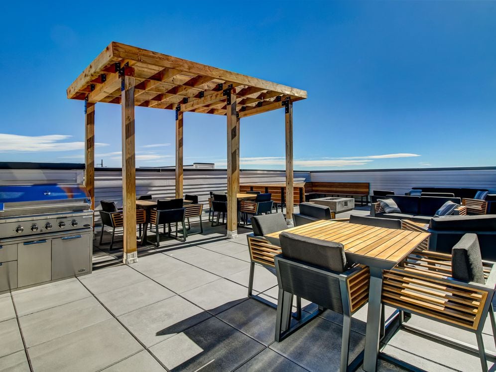 Resident's clubhouse with entertaining kitchenette, flat-screen television, billiards, and more