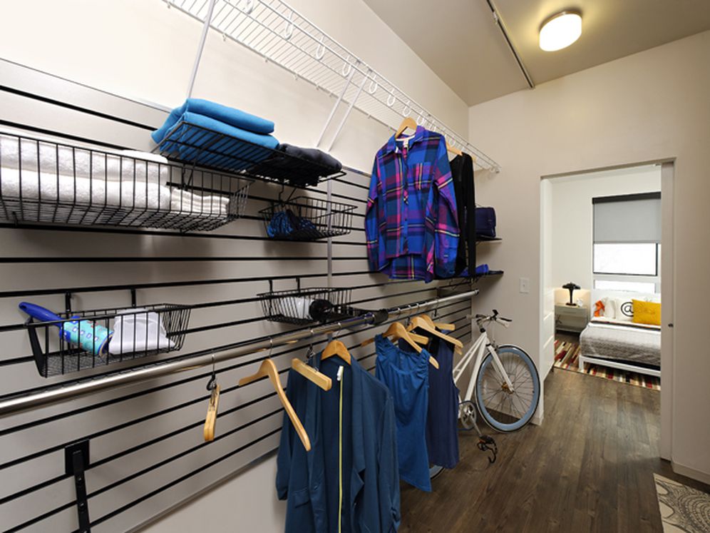 Urban customizable slat wall closet with hard surface flooring