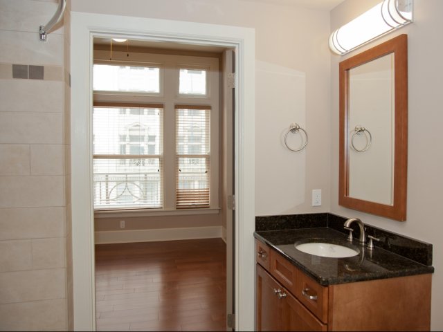 Granite Surfaces and Excellent Vanity Space in Bathrooms