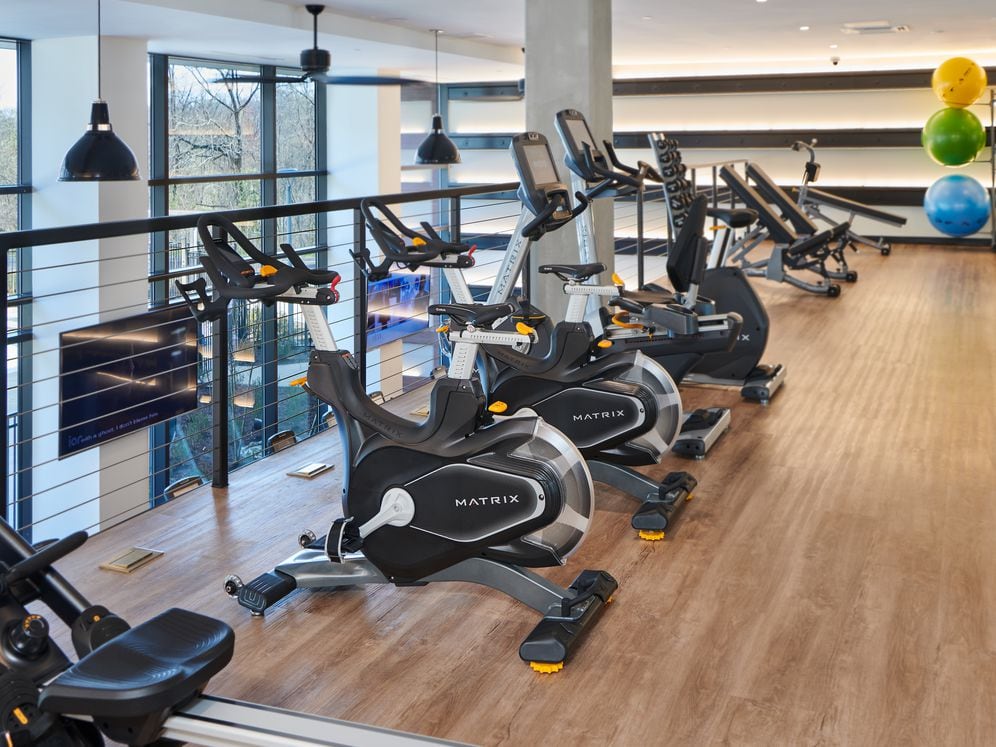 Upper level fitness center with spin bikes and free weights