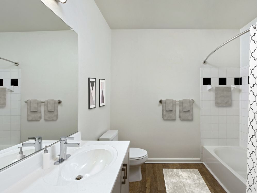 Renovated II bathroom with white cultured marble countertop and hard surface flooring