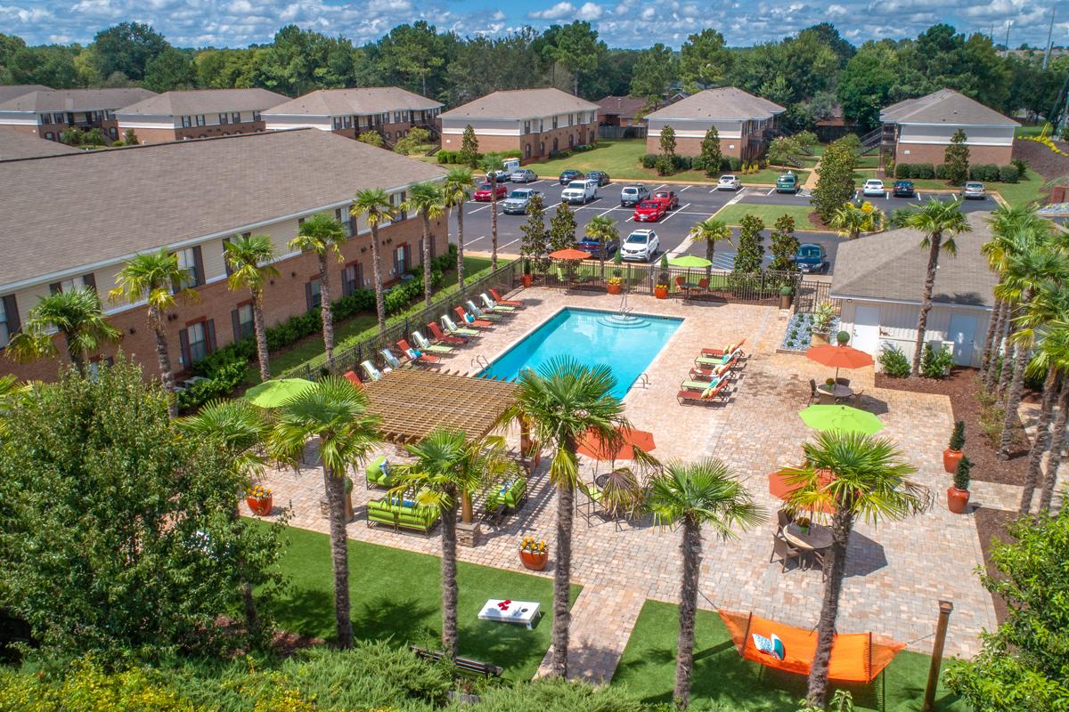 Resort-style pool with sundeck, cabanas and relaxing hammocks.