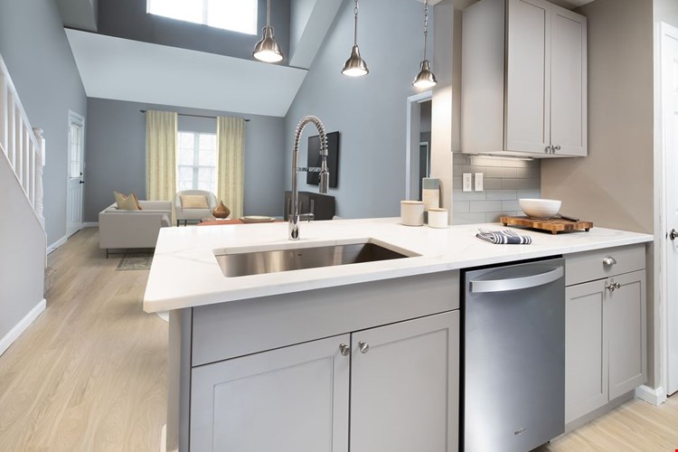 Premier Finish kitchen, dining, and living areas with hard surface flooring