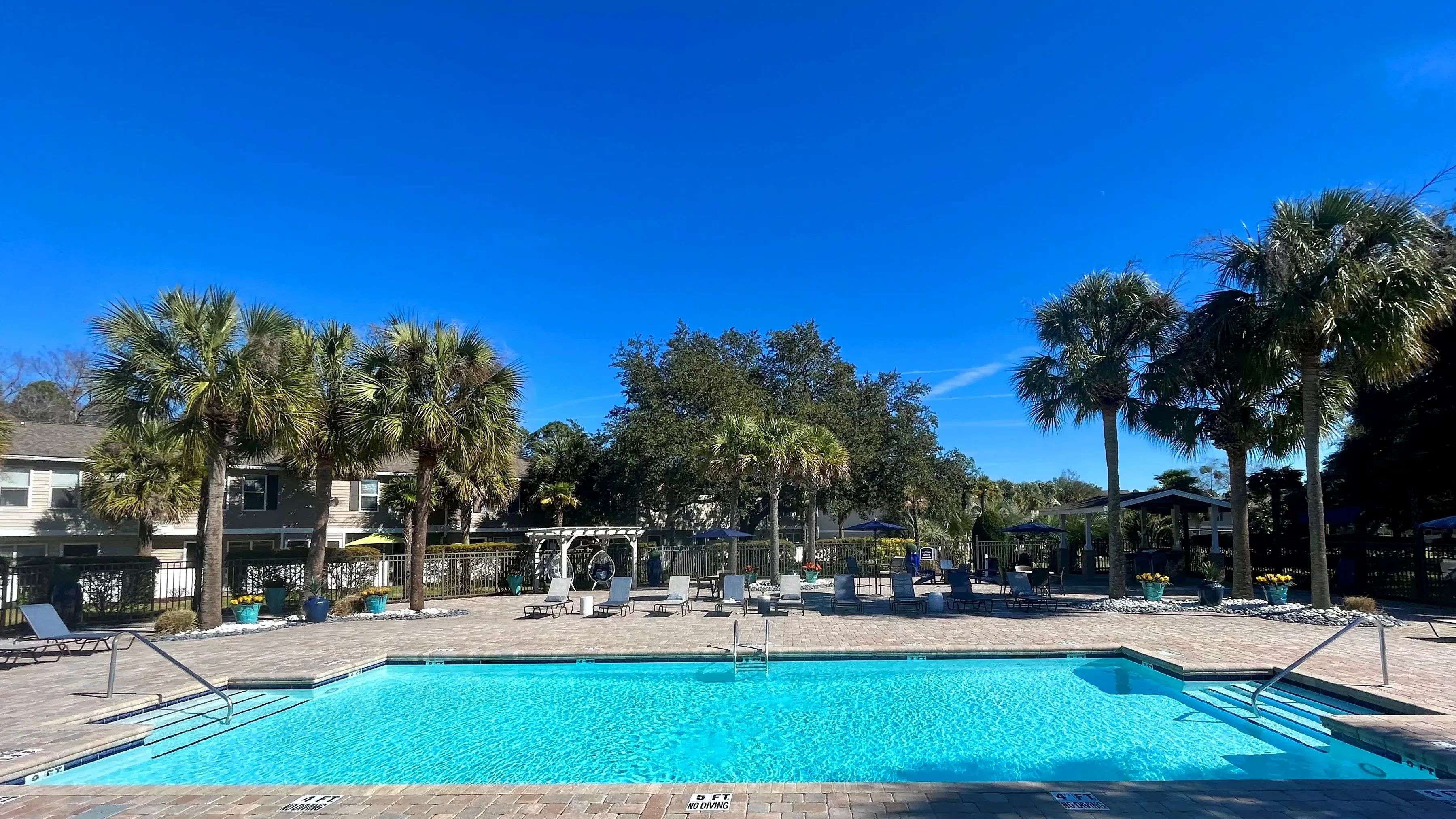 Immerse in the joy of our resort-style pool and expansive sundeck—a sunlit tropical paradise.