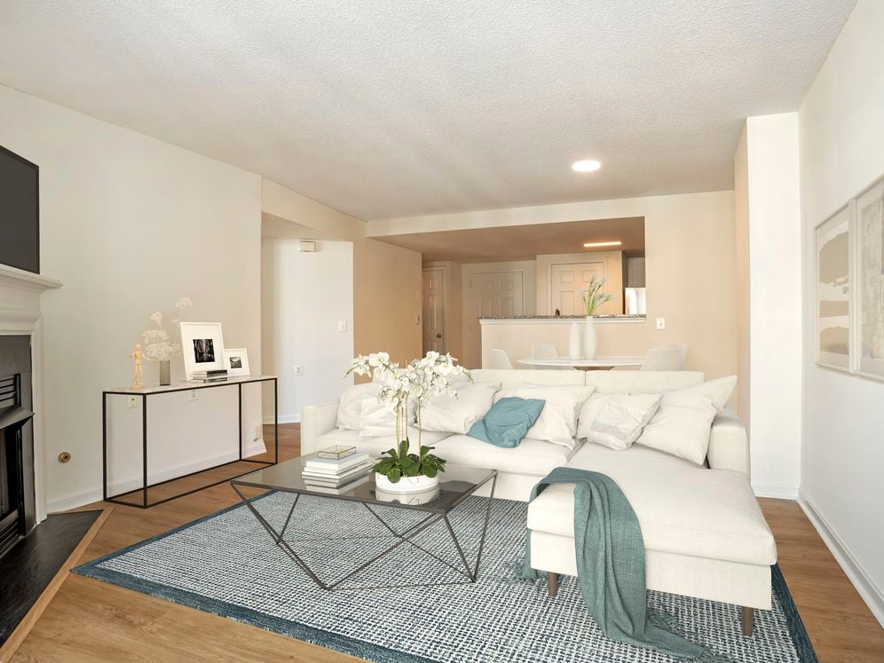 Renovated Package I kitchen, living, and dining areas with hard surface flooring