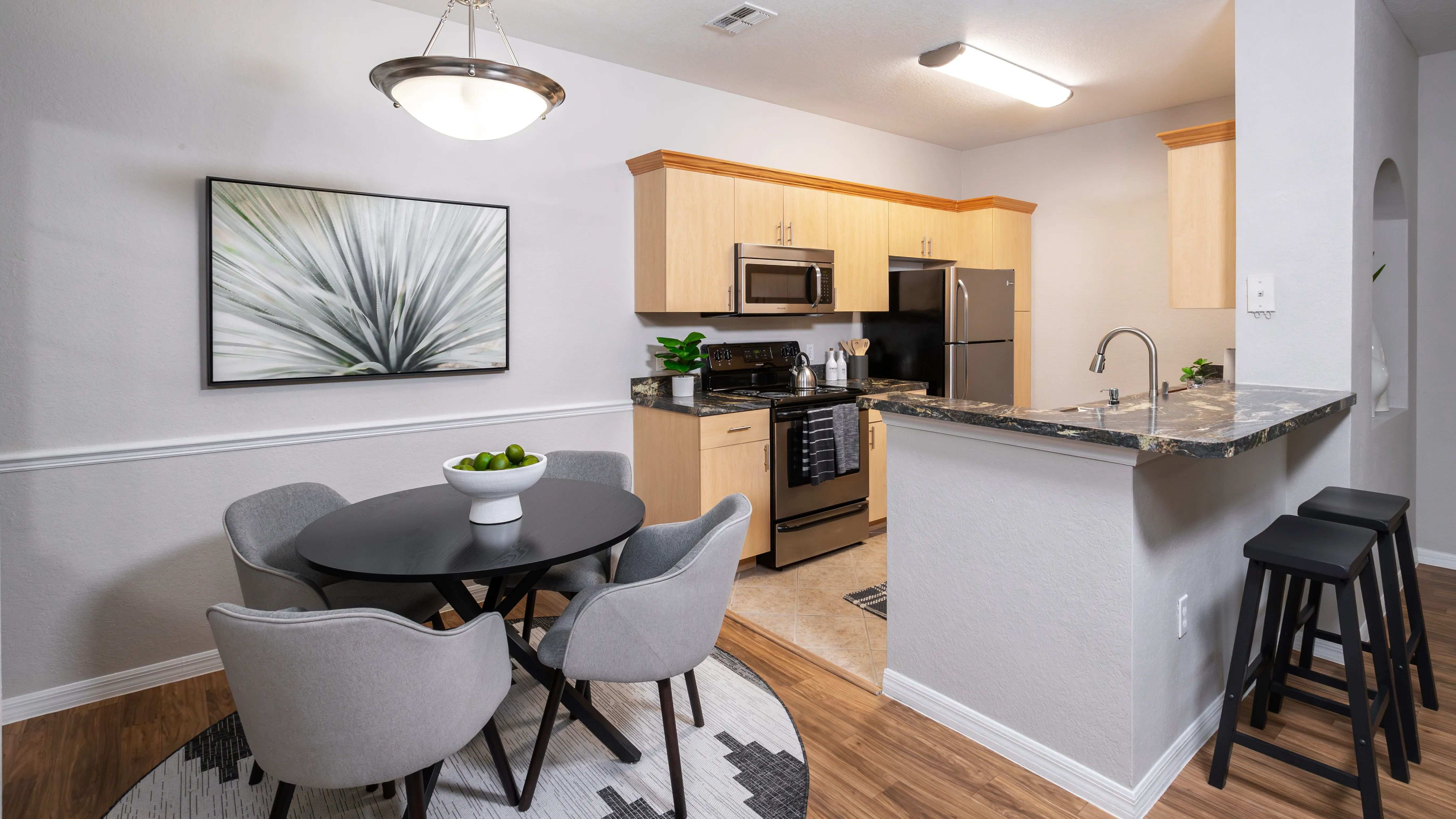 Enjoy an inviting open-concept kitchen and dining space, complete with a stylish breakfast bar.