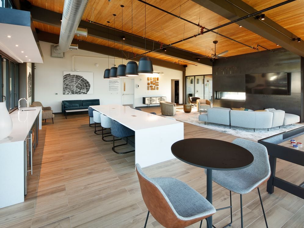 Phase II 6th Floor Lounge with multiple seating areas, fireplace, and TV