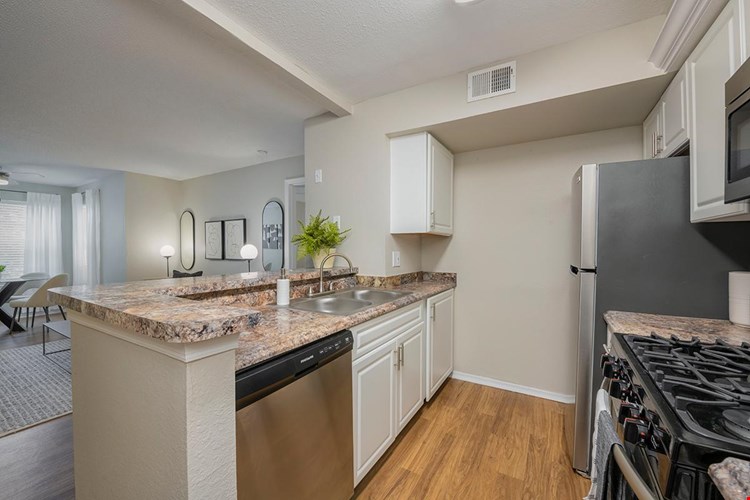 Kitchens feature a breakfast bar overlooking the living area.