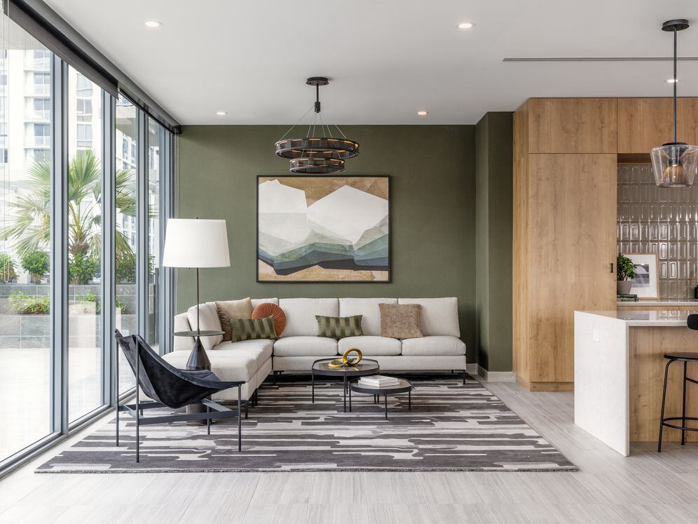 Resident lounge with modern seating and kitchenette