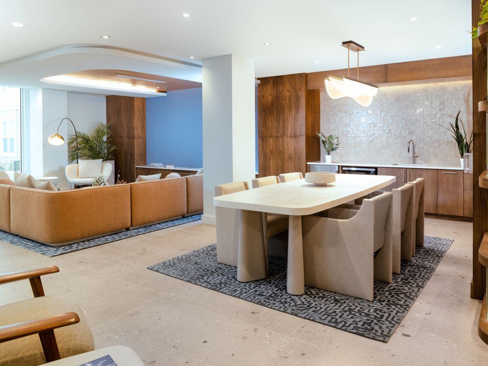 Lounge with kitchenette and seating areas