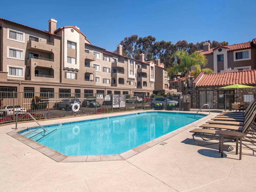 Swimming pool and sundeck with lounge seating