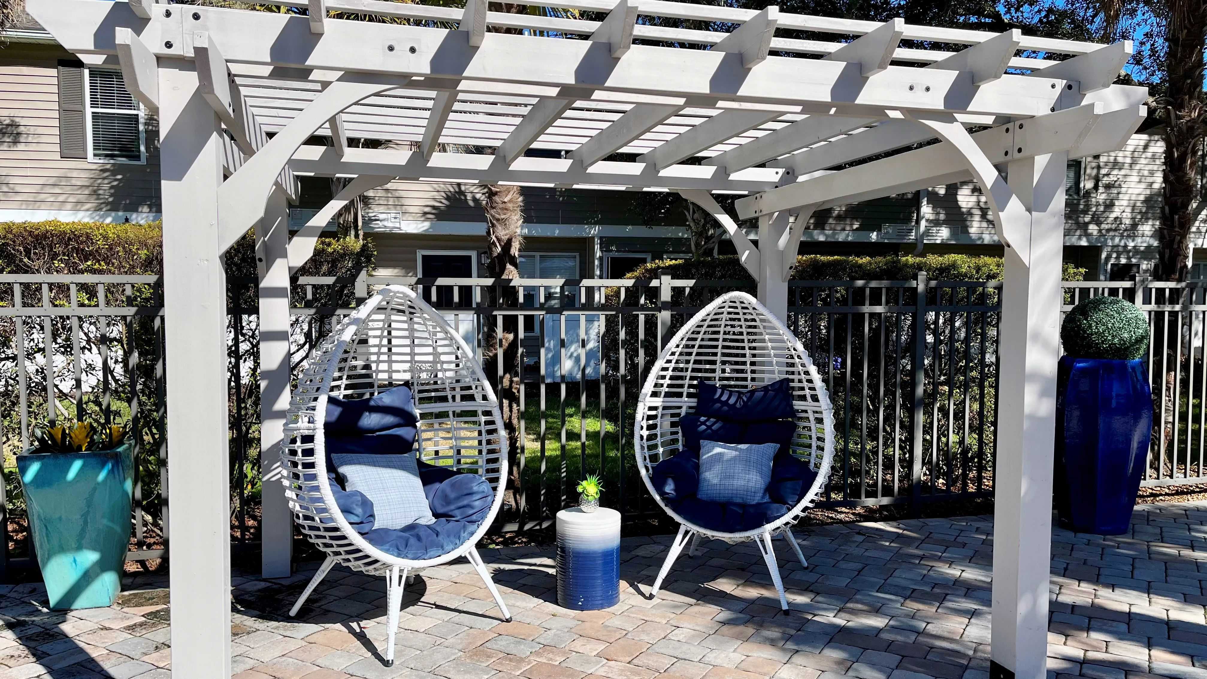 Relax and find tranquility under our poolside pergola retreat.