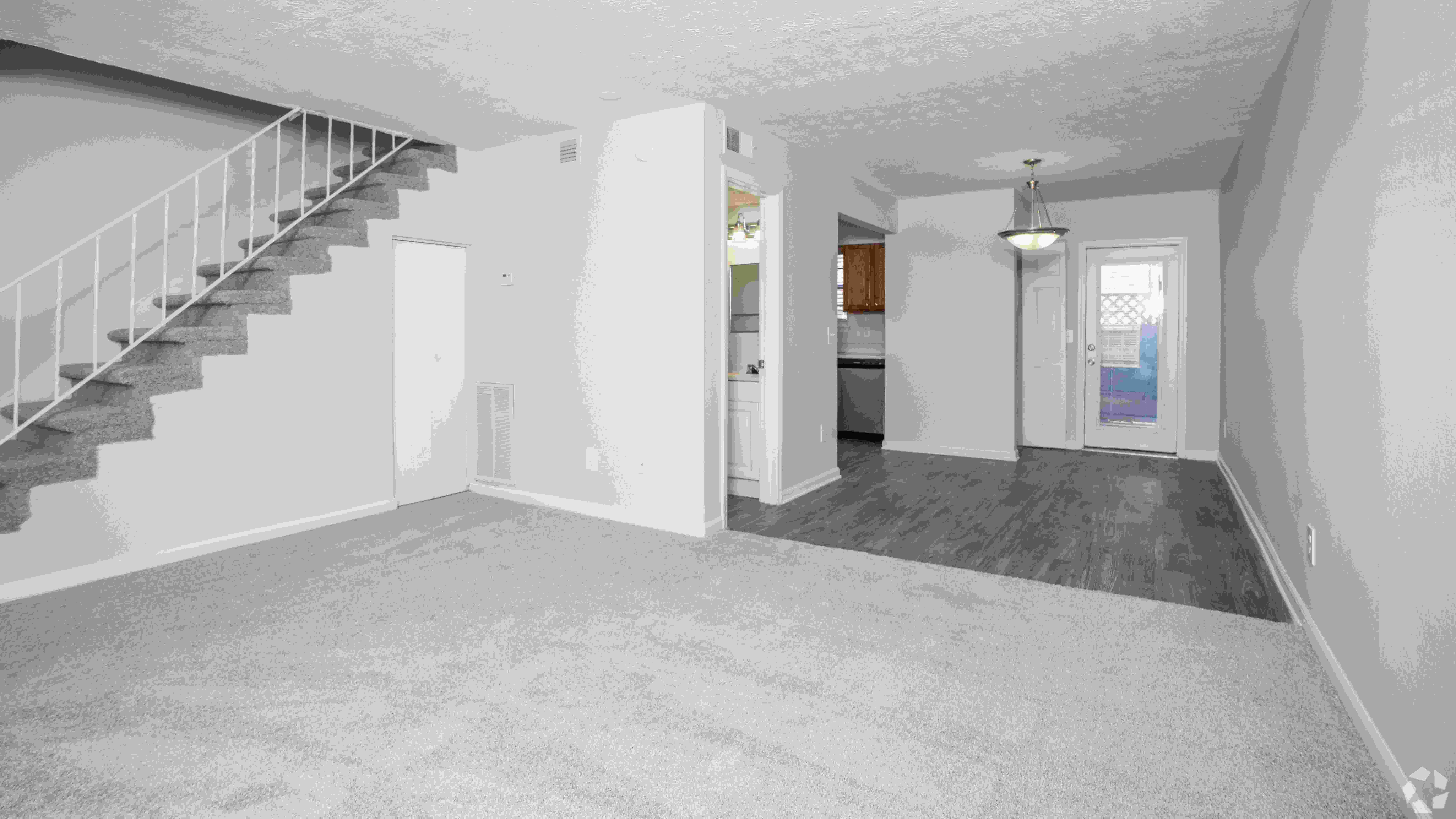 The Roswell floor plan features an open layout with plush carpeting and direct access to the dining area.