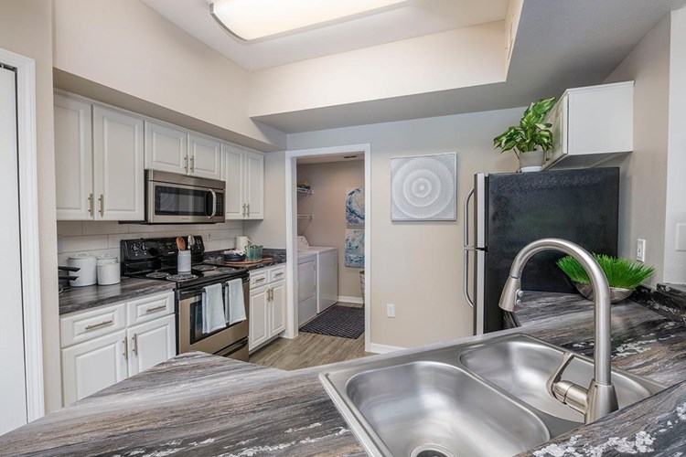 New remodeled kitchens featuring breakfast bars, granite-style counter tops, and stainless steel appliances.