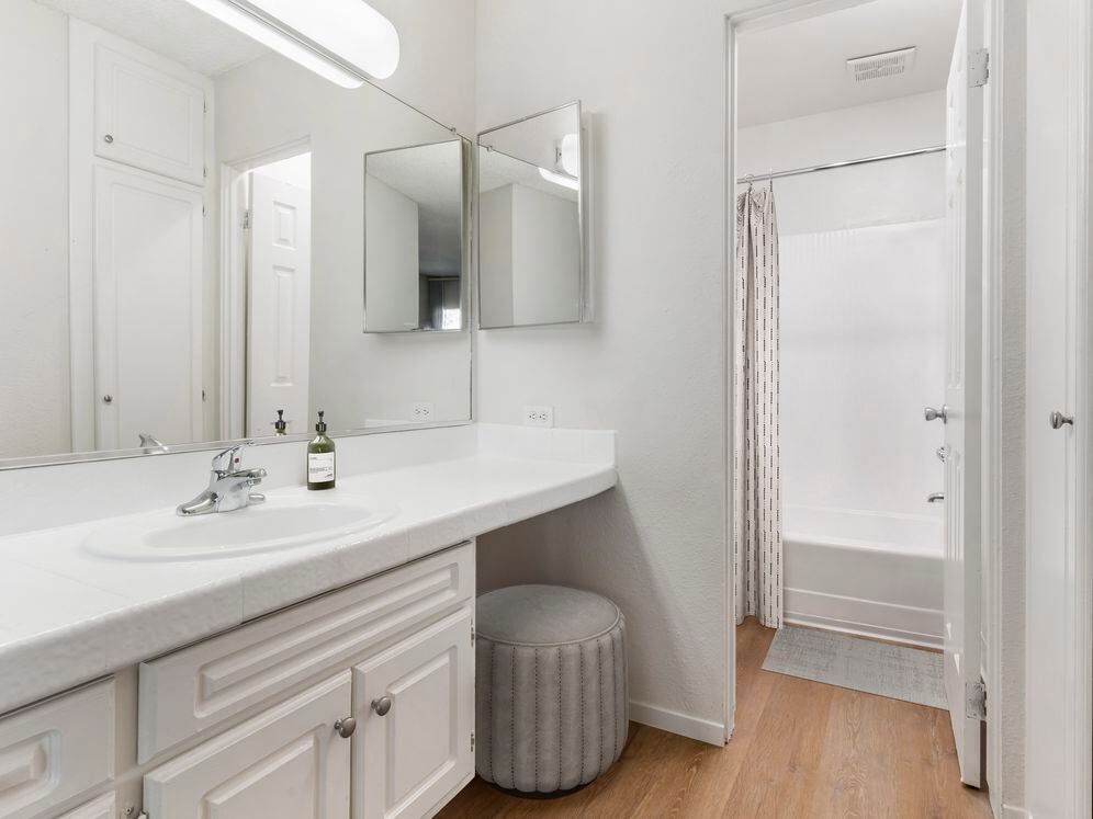 Classic Package II bath with white tile countertop, white cabinetry, and hard surface flooring
