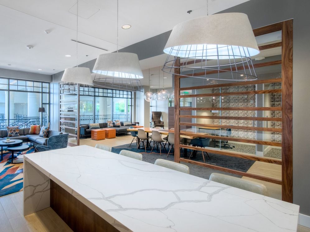 Resident lounge with shared workspaces and seating