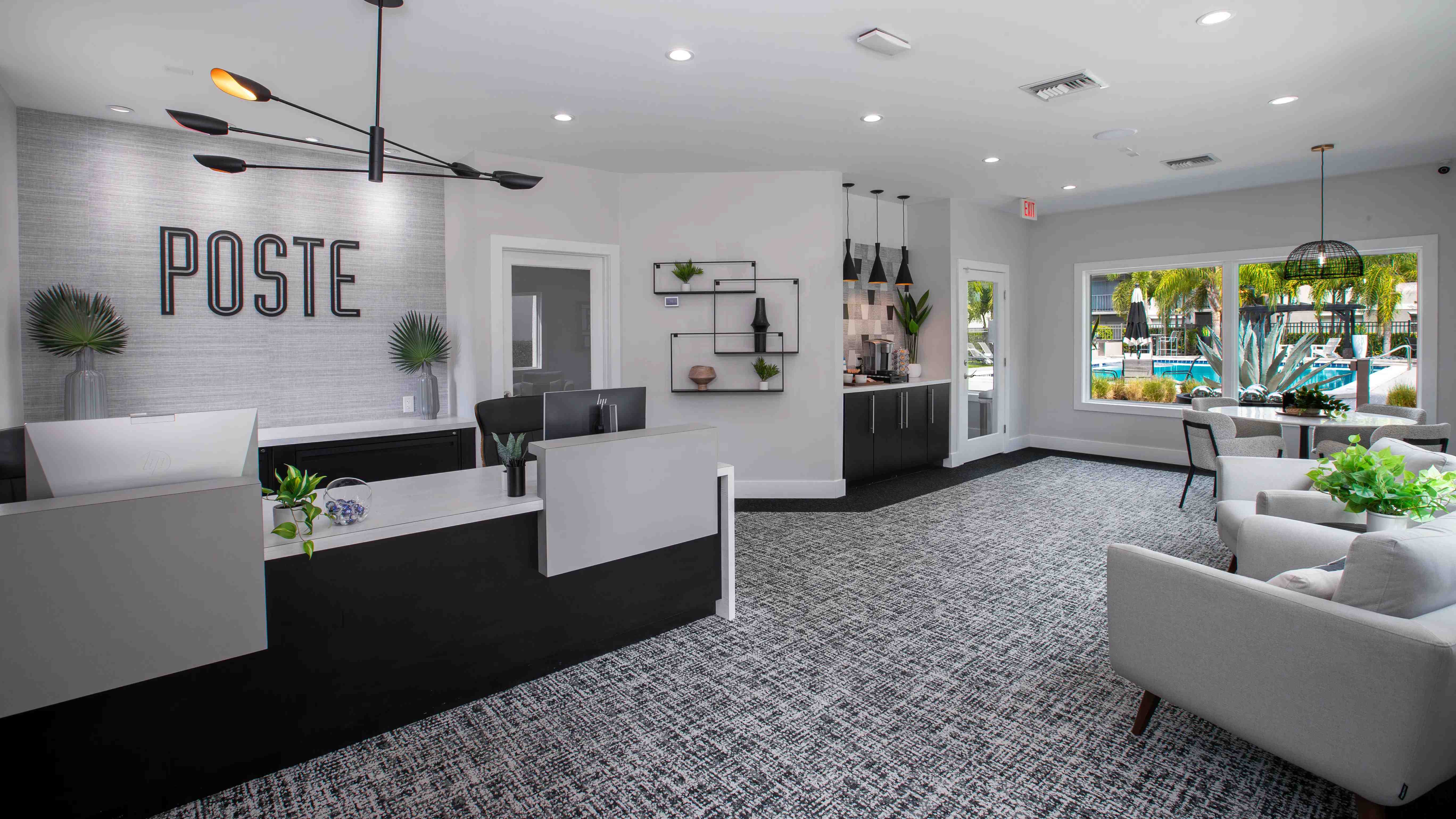 Step into the bright and inviting leasing office at Poste Winter Park Apartments. ith a sleek design, refreshment station, and large windows overlooking the pool, this space invites you to feel at home from the moment you enter.