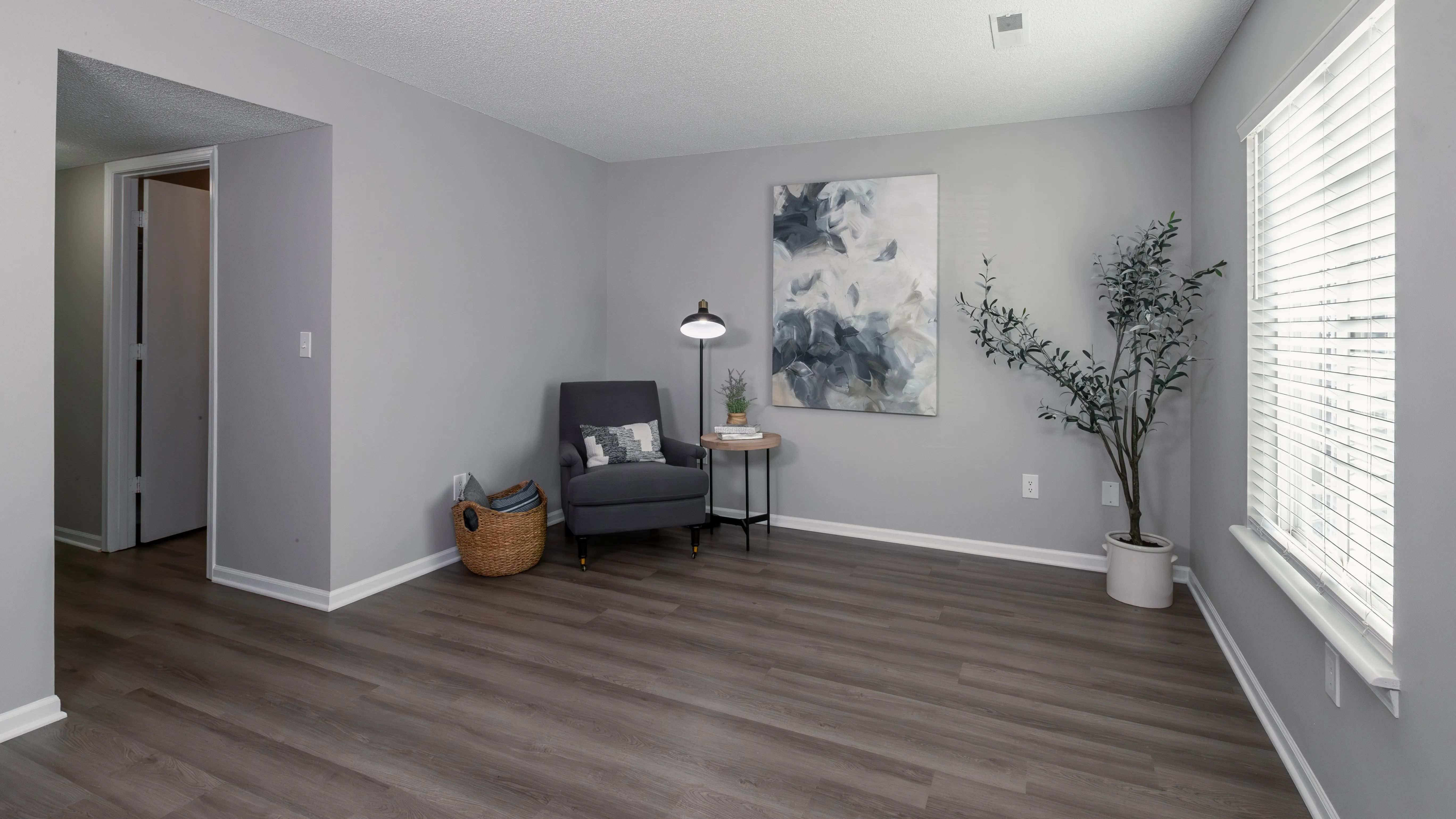 This inviting living area features modern decor, comfortable seating, and ample natural light, creating a perfect space for relaxation and leisure.