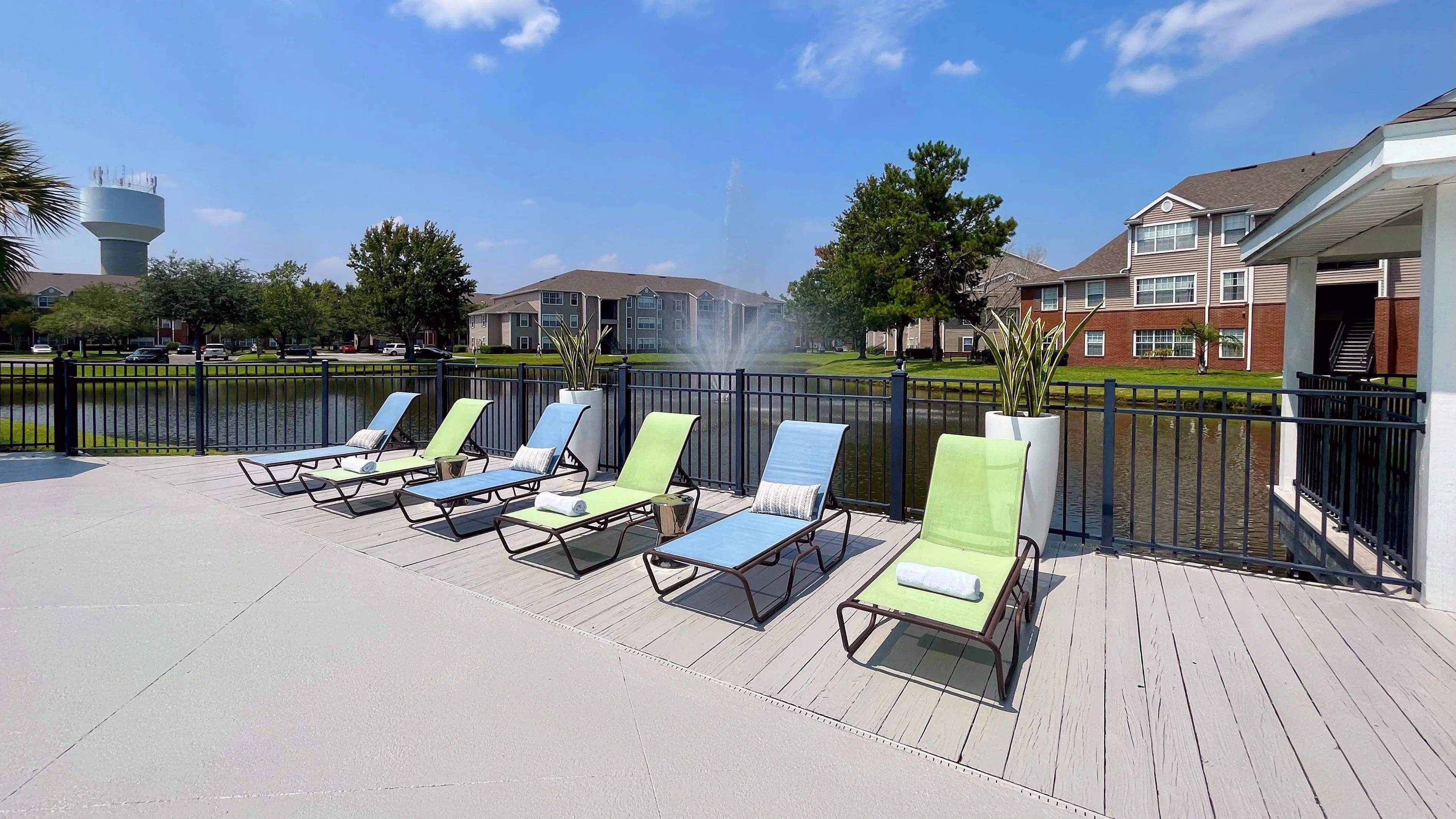 Residents can enjoy sun-drenched relaxation by the water's edge with rows of loungers offering tranquility by the water. Make this your ultimate relaxation destination!