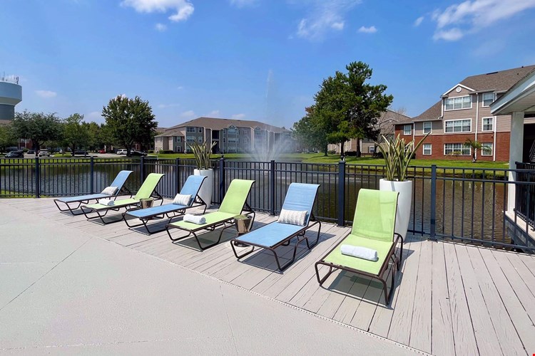 Residents can enjoy sun-drenched relaxation by the water's edge with rows of loungers offering tranquility by the water. Make this your ultimate relaxation destination!