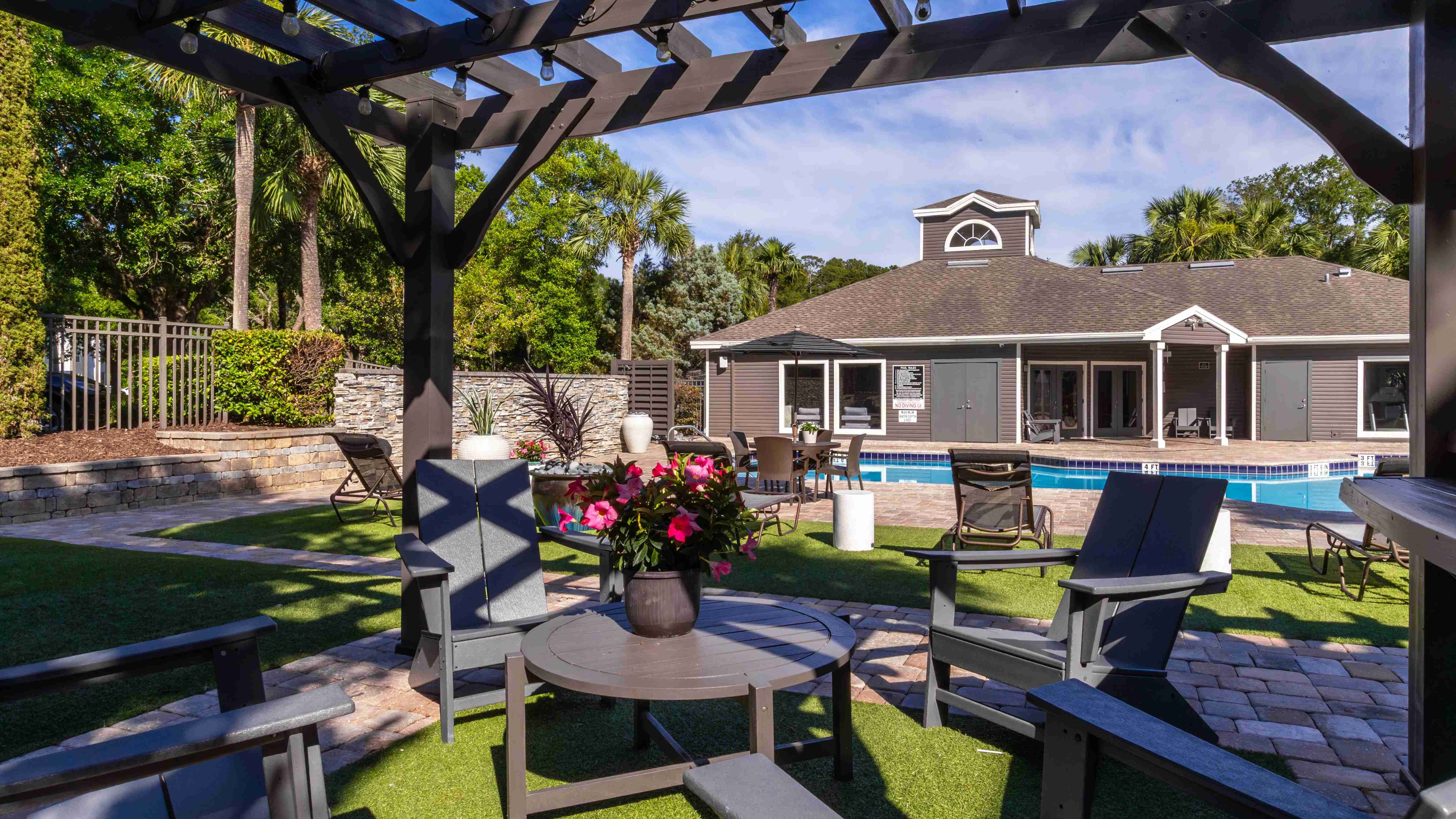 Enjoy a shady escape under our stylish pergolas—perfect for unwinding, reading, or catching up with friends just steps from the pool.