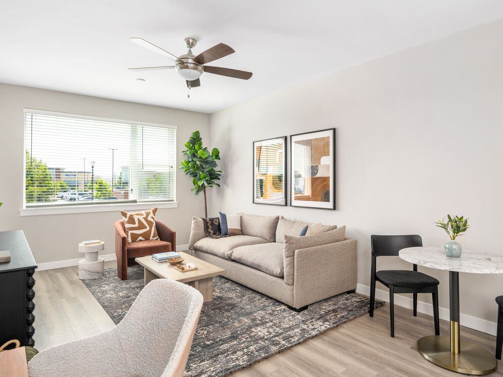 Finish Package II Living area with hard-surface vinyl plank flooring throughout and ceiling fan