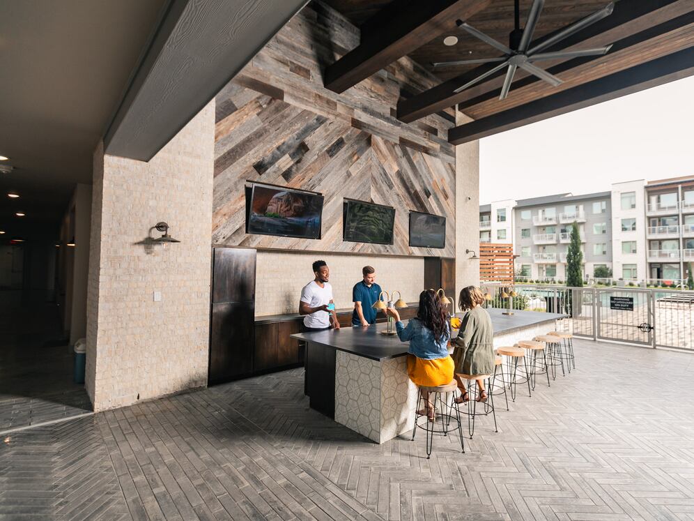 Outdoor lounge with TVs