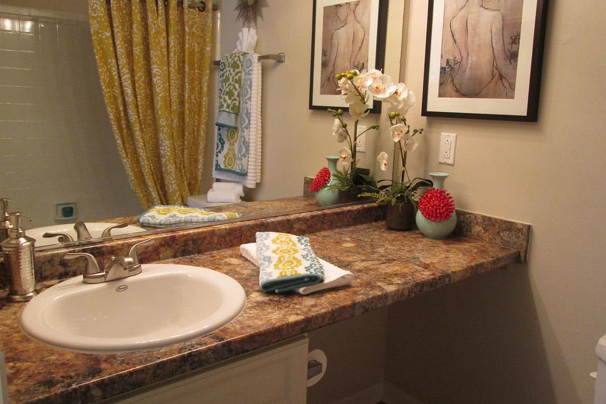 Updated cabinets, countertops and lighting fixtures complete each private master bathroom.  Youâ€™ll love the extra counter space!