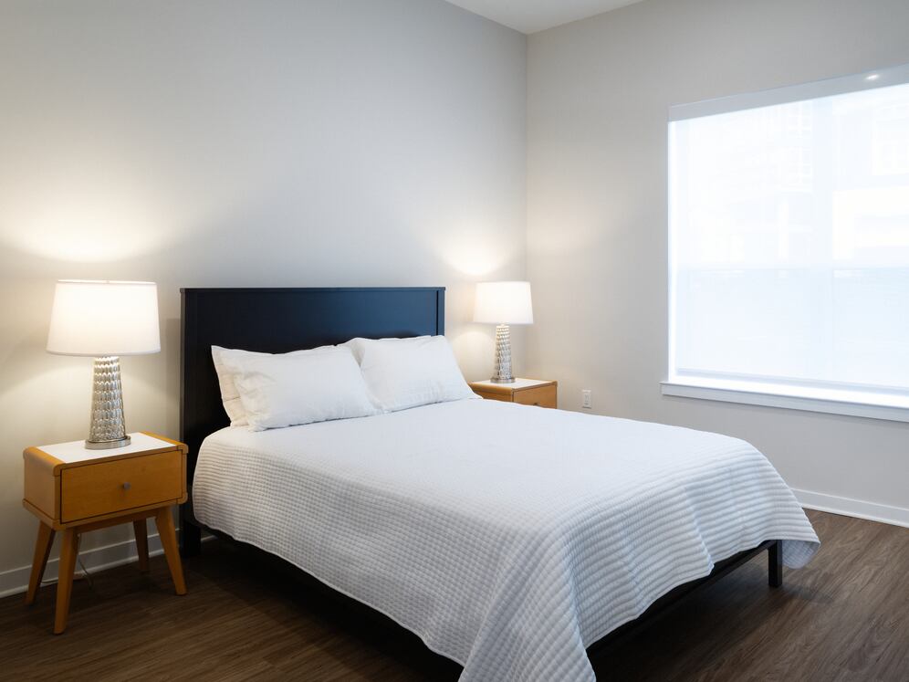 Upgrade Collection Bedroom with hard-surface vinyl plank flooring