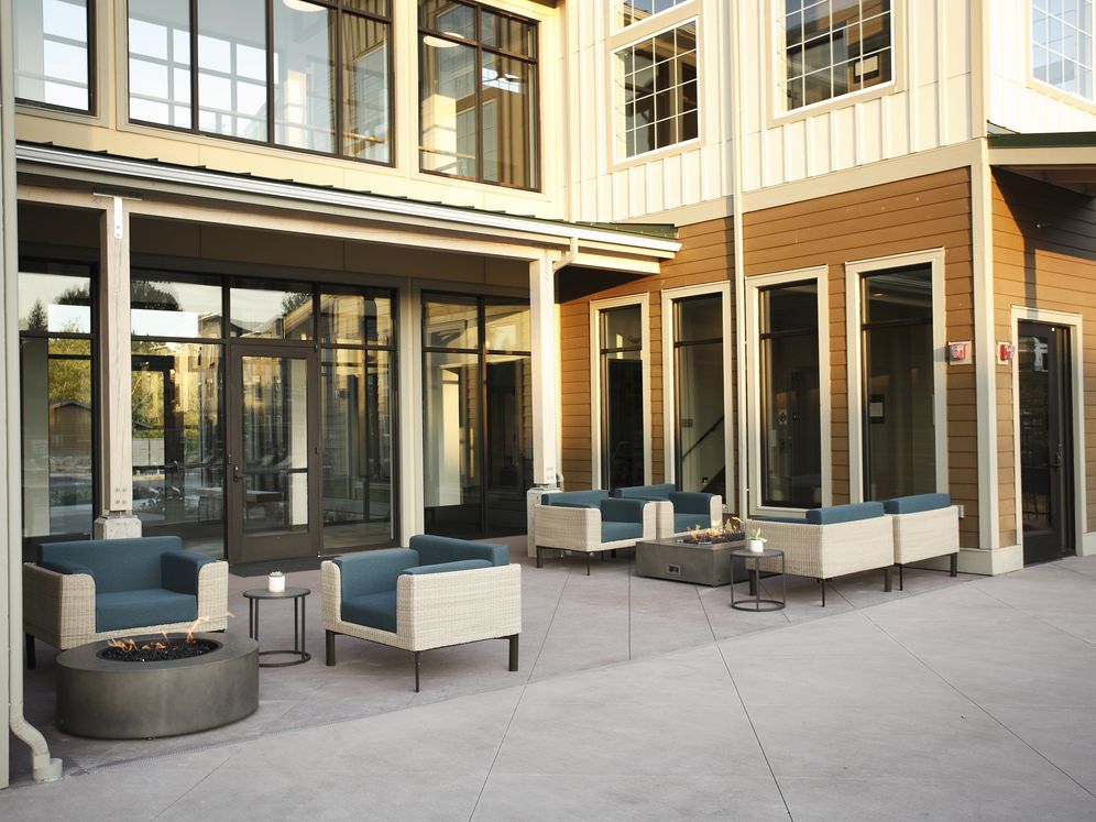 Outdoor lounge with fireplace and lounge seating