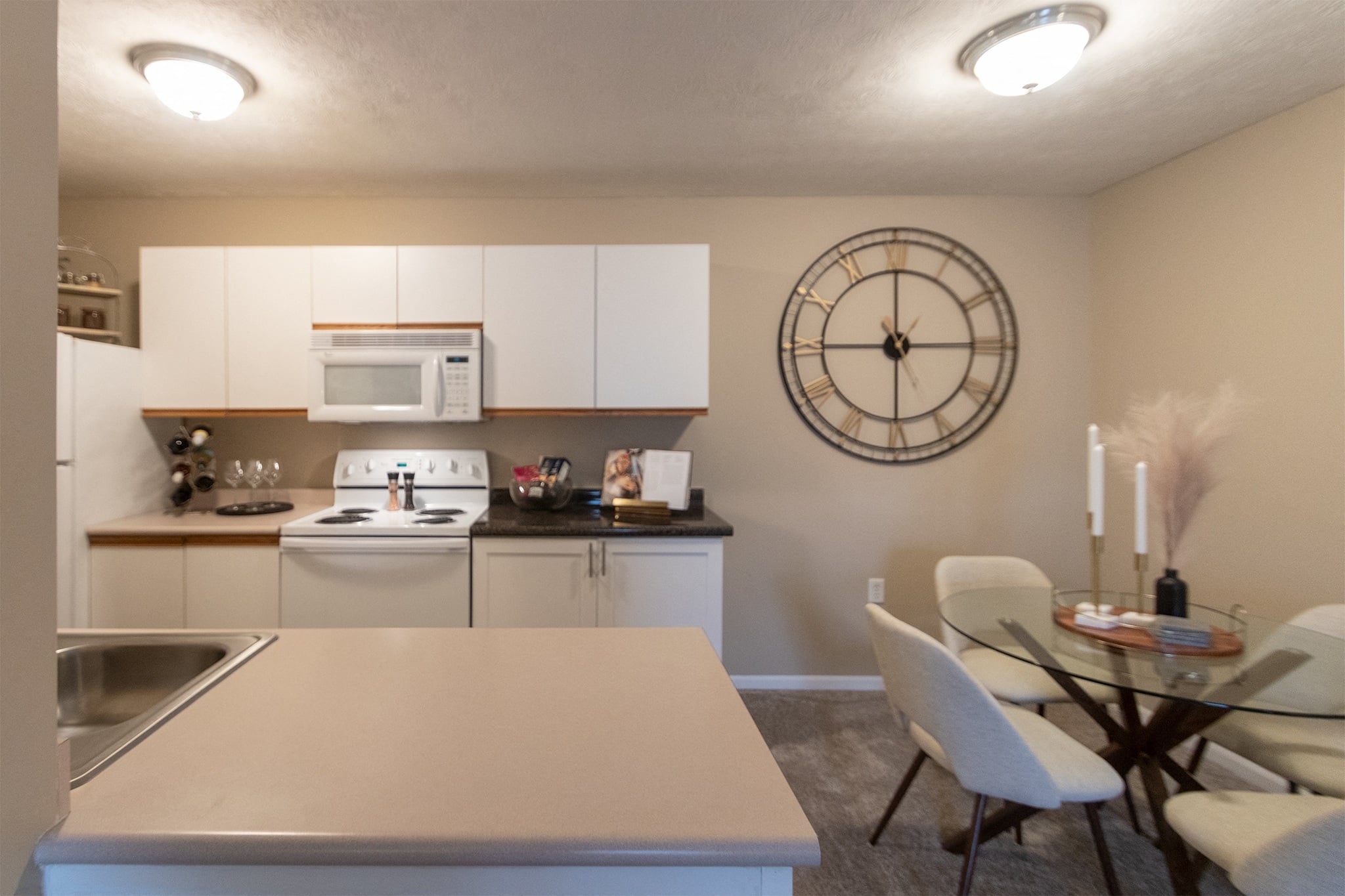 Our model Liberty kitchen features both upgraded cabinetry with dark countertops and classic cabinetry with light countertops.